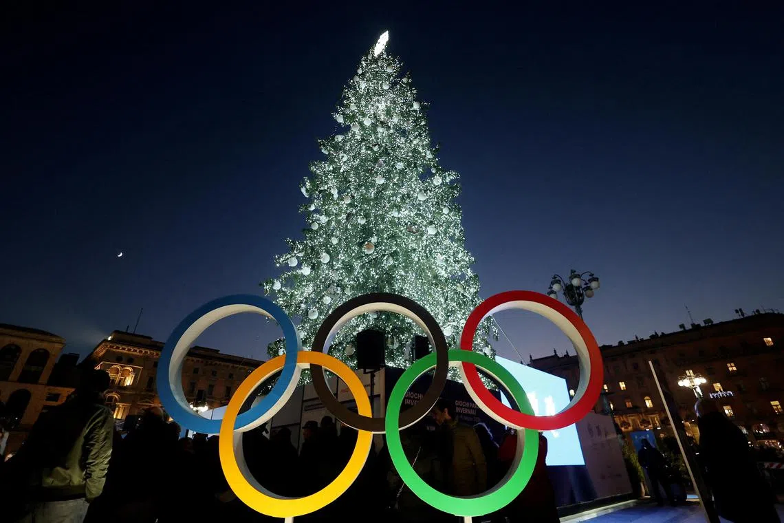 The Olympics rings for the Milano-Cortina 2026 Winter Games are seen in front of the Christmas tree in Piazza del Duomo in Milan.