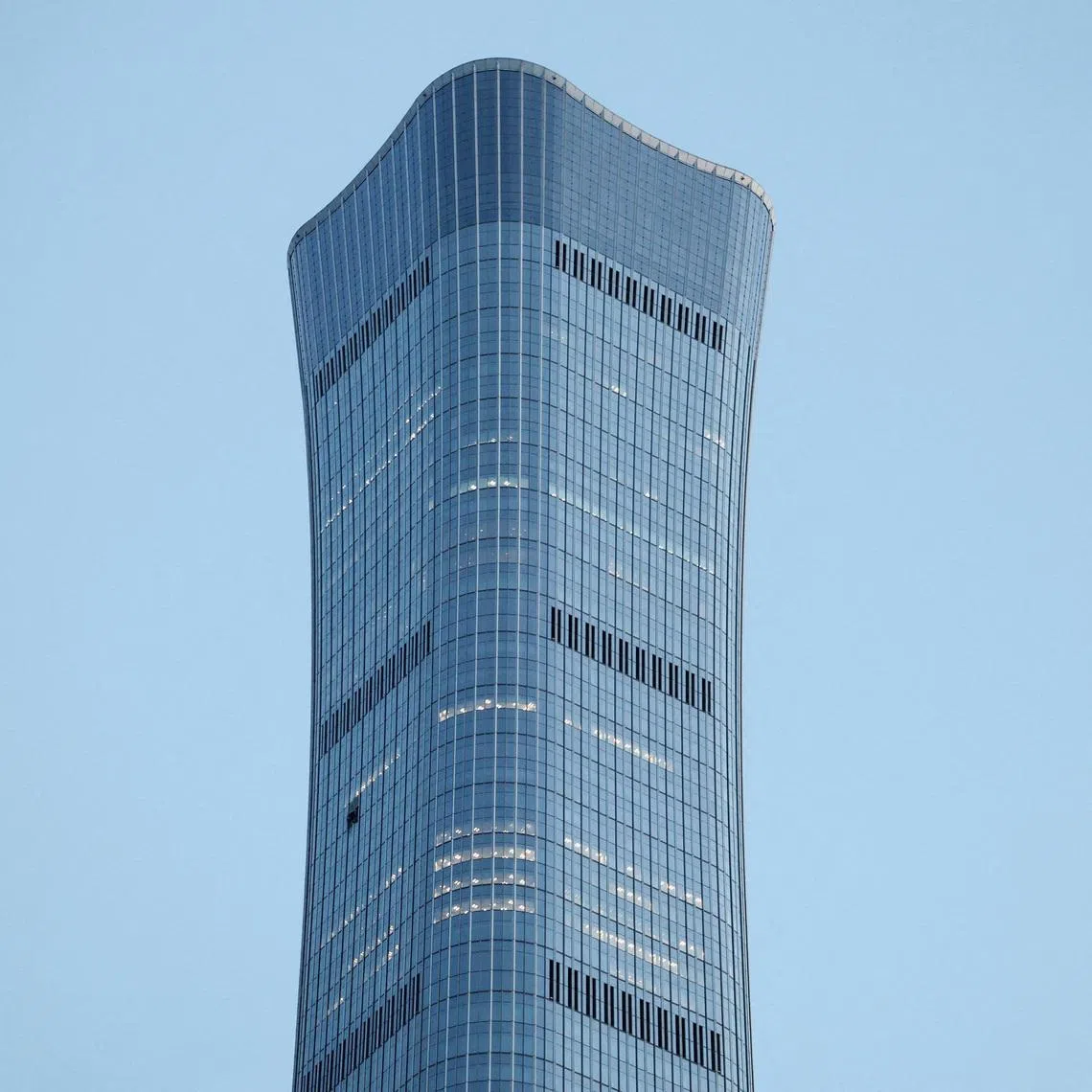 Visible damage to the CITIC Tower in Beijing after the crash killed the plane’s pilot and injured 13 other people at the site.
