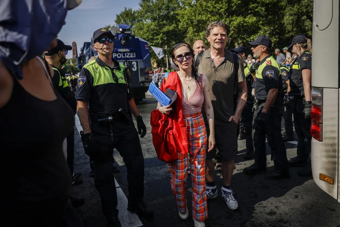 epa10850510 Dutch actress Carice van Houten participates in the action by climate activists of the 'Extinction Rebellion' group blocking the Utrechtsebaan on the A12 route in The Hague, The Netherlands, 09 September 2023. The demonstrators demand that the government should immediately stop granting fossil subsidies, meaning all financial arrangements that favor the use of fossil fuels.  EPA-EFE/RAMON VAN FLYMEN