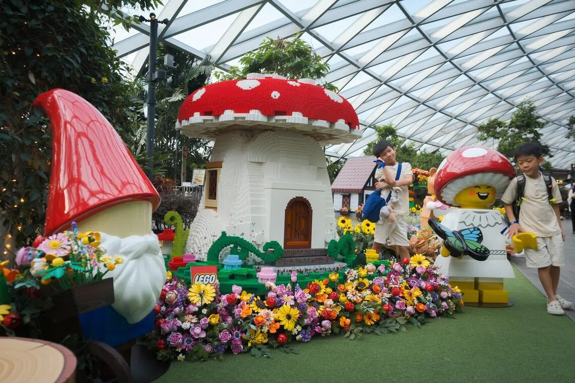 An English country garden scene inspired by the Lego Icons Autumn Cottage Garden and built using Lego bricks at Jewel Changi Airport’s Canopy Park on May 26.