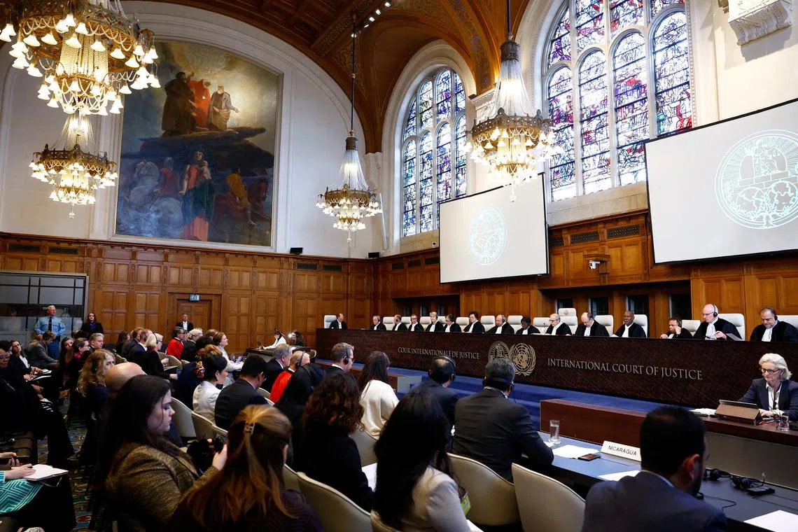 Judges and delegates sit in the courtroom as Nicaragua is set to ask the International Court of Justice on Monday to order Berlin to halt military arms exports to Israel and reverse its decision to stop funding U.N. Palestinian refugee agency UNRWA, in The Hague, Netherlands, April 8, 2024. REUTERS/Piroschka van de Wouw