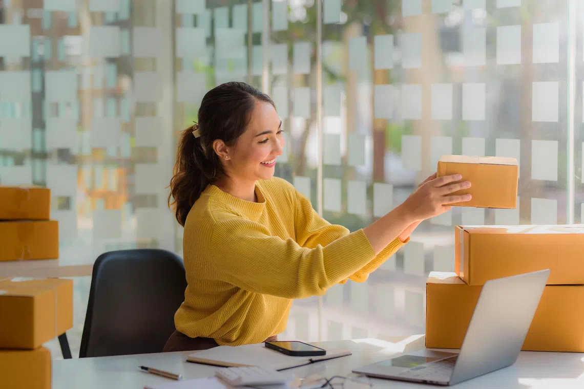 Shopee seller packing her boxes