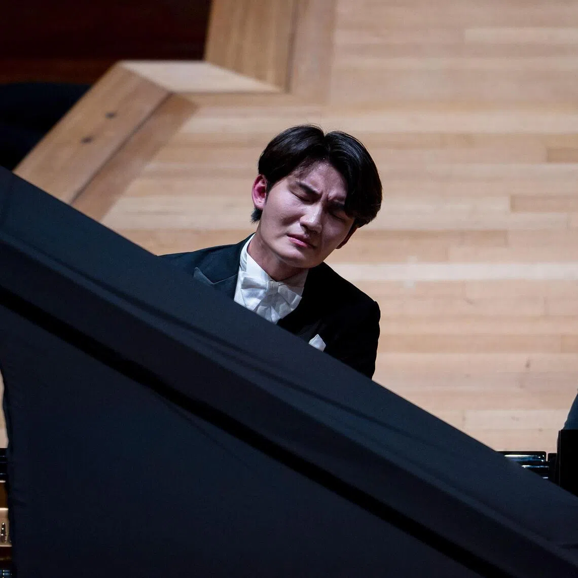 Pianist Niu Niu at the Esplanade Concert Hall on Oct 27 where he played eight concertos and tried his hand at playing the violin too.