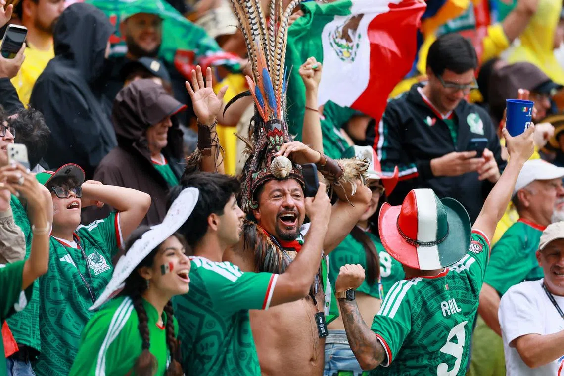 Mexico fans celebrating after Raul Jimenez scores their second goal against South Africa on June 11. 