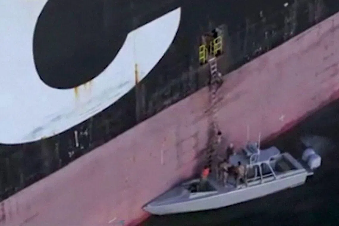 A screen grab released by Iran's Revolutionary Guards (IRGC) and made available via Iran's state broadcaster (IRIB) on April 23, 2026, showing IRGC naval forces allegedly boarding a ship attempting to cross the Strait of Hormuz. 