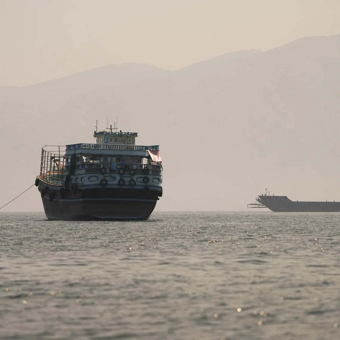 Vessels at the Strait of Hormuz, as seen from Musandam, Oman, June 22, 2026. REUTERS/Stringer