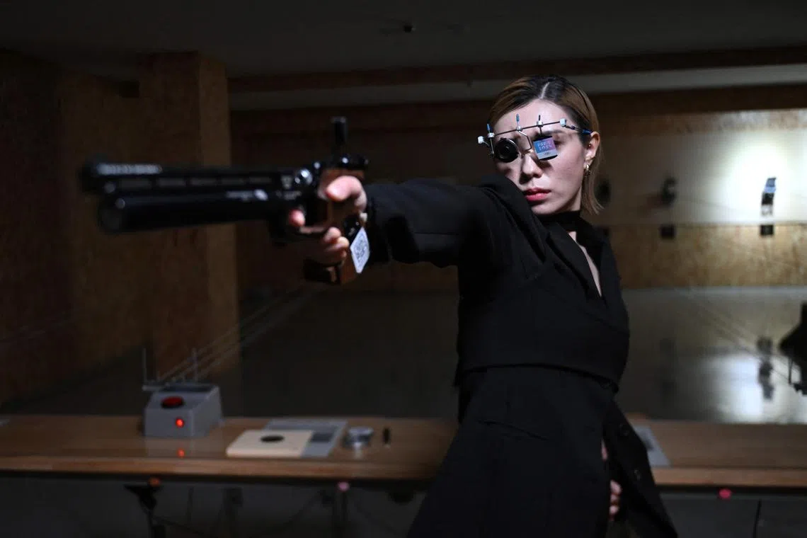 South Korean shooter Kim Ye-ji posing during an interview with AFP at a shooting range in Seoul on Oct 22, 2024. The 32-year-old won Paris Olympic silver in the women's 10m air pistol and captured the internet's attention with her nonchalant cool.