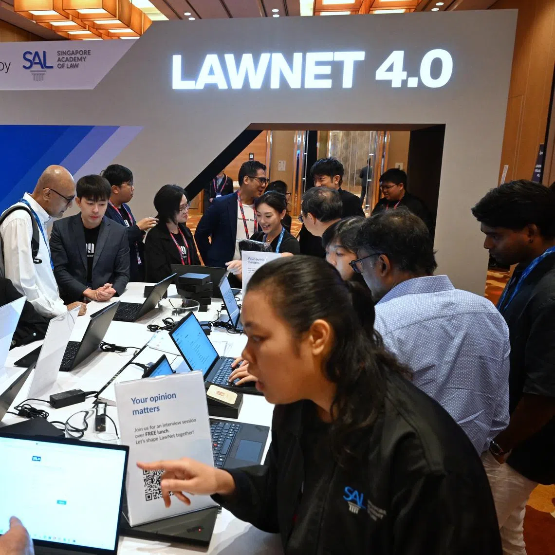 Participants visiting the exhibition booths on the second day of the TechLaw.Fest at the Sands Expo and Convention Centre on Sept 11 .