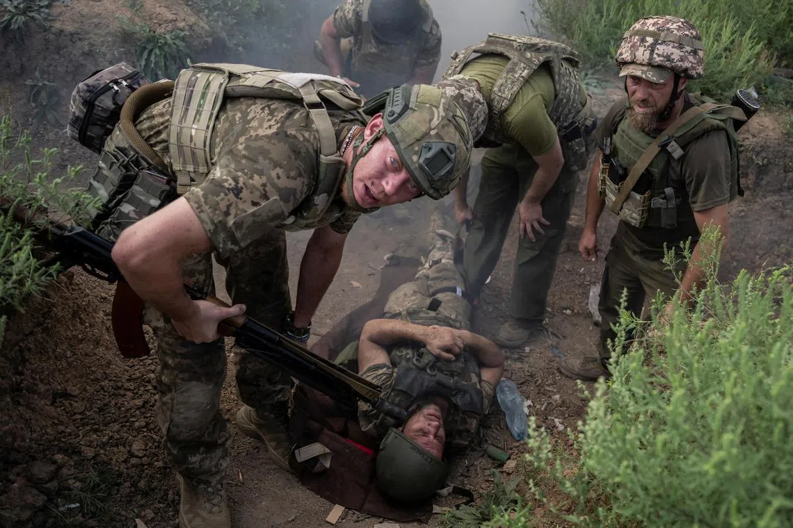 Ukrainian servicemen attend military exercises at a training ground in Ukraine.
