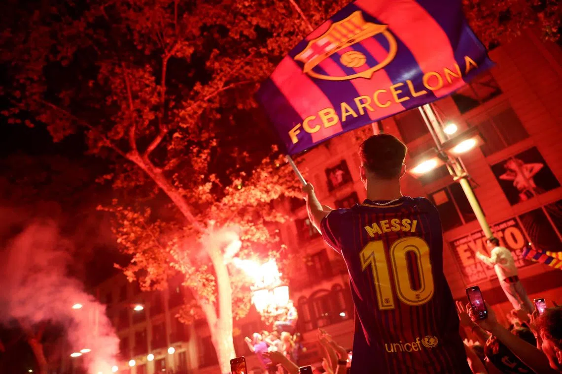 Barcelona fans celebrating after winning the La Liga following a 4-2 away win at local rivals Espanyol on Sunday.