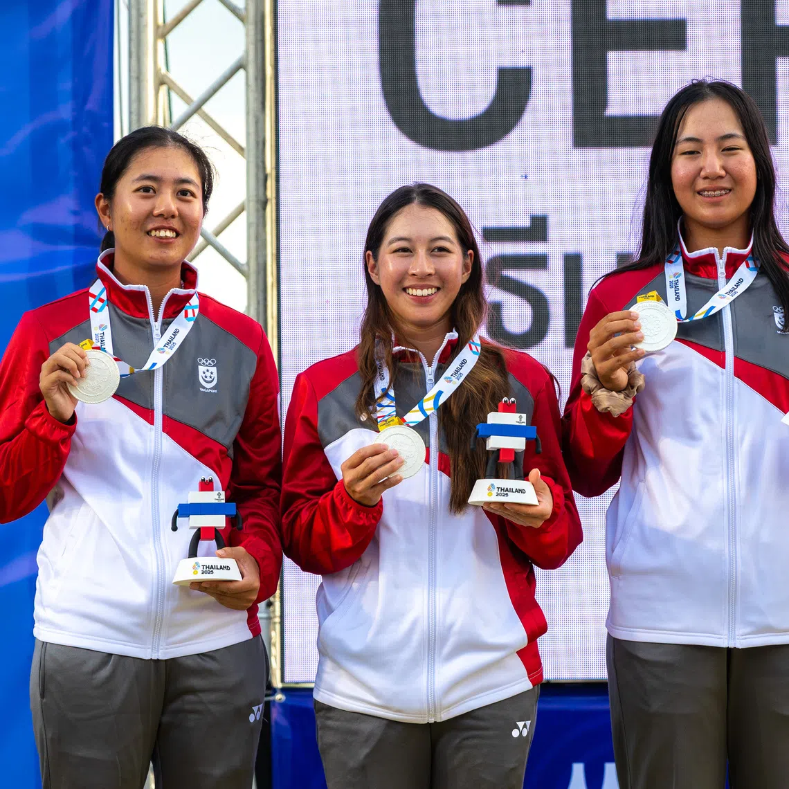 (From left) Singaporean golfer Inez Ng, Valencia Chang and Chen Xingtong clinched the women's team silver at the SEA Games on Dec 14, 2025.