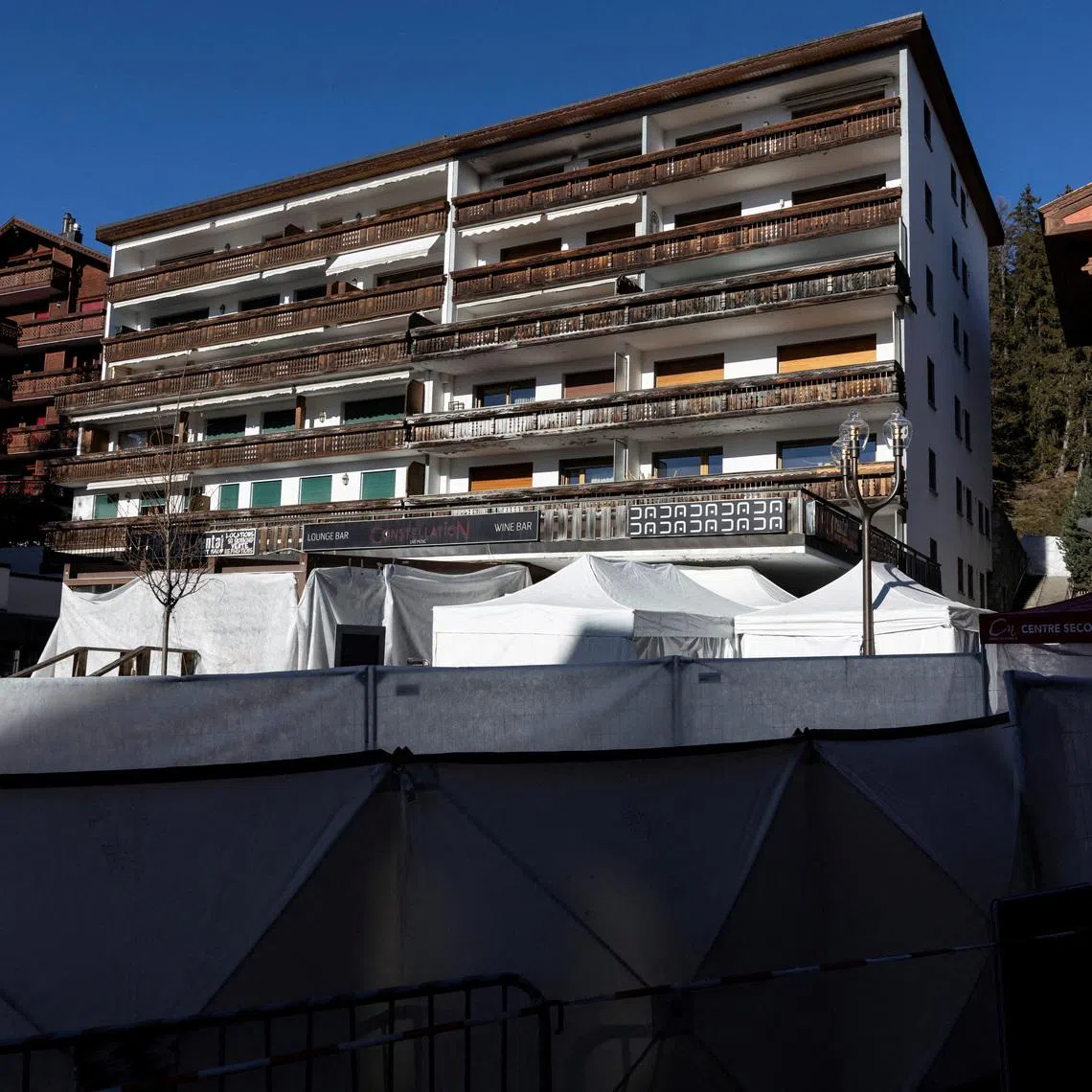 FILE PHOTO: A general view of the \"Le Constellation\" bar, after a deadly fire and explosion during a New Year's Eve party in the upscale ski resort of Crans-Montana in southwestern Switzerland, January 6, 2026. REUTERS/Umit Bektas/File Photo