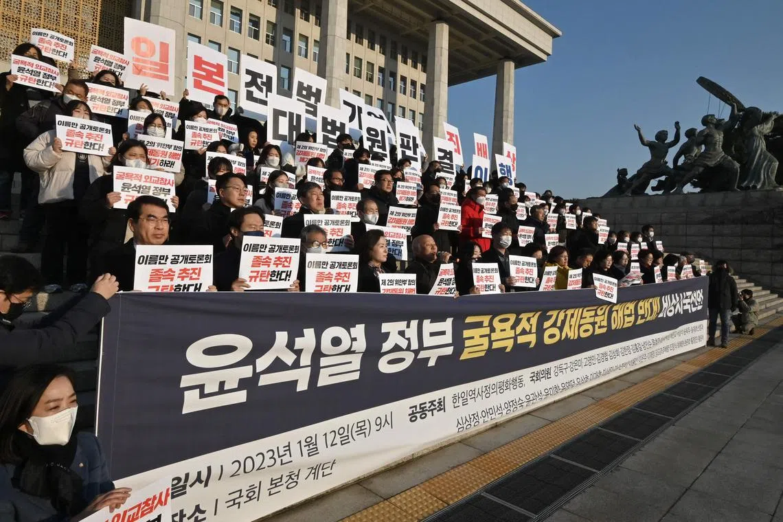 South Korean opposition lawmakers and supporters of the victims of Japan's wartime forced labour protesting in Seoul on Jan 12, 2023.