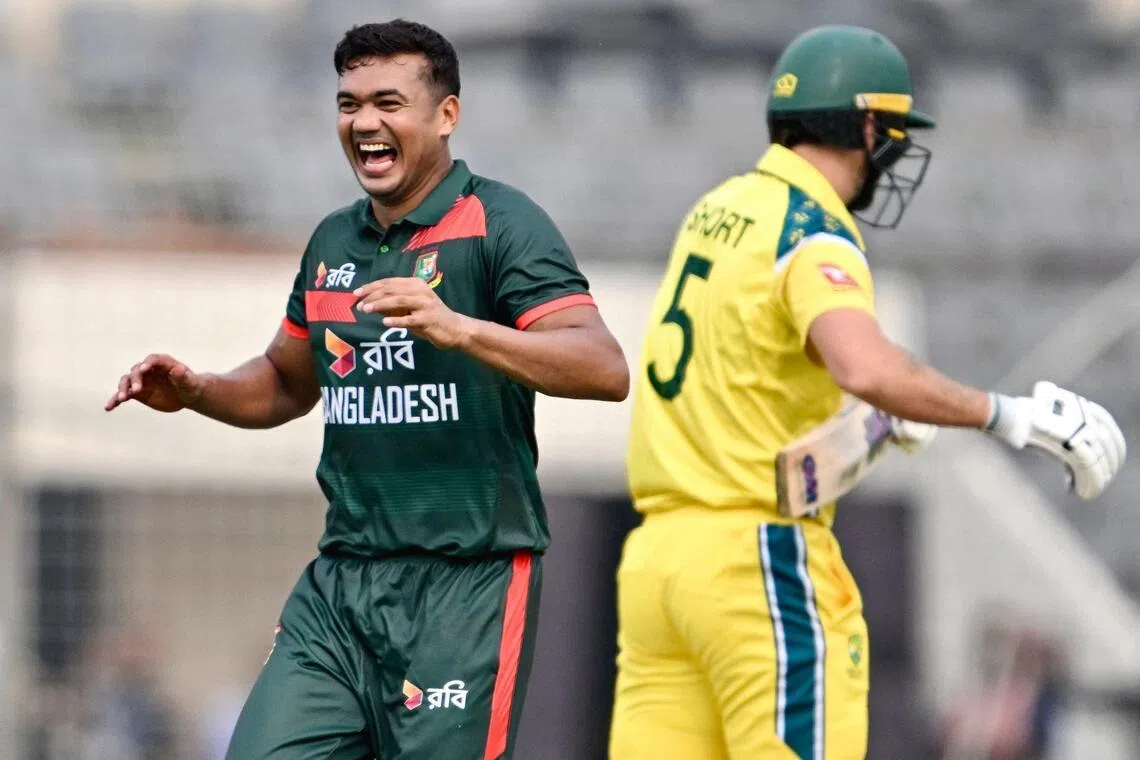 Bangladesh's Taskin Ahmed celebrates after taking the wicket of Australia's Matthew Short in the first one-day international (ODI) at the Sher-e-Bangla National Cricket Stadium in Dhaka on June 9, 2026.
