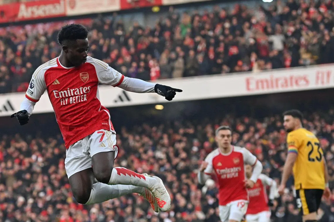 Arsenal's Bukayo Saka celebrates scoring the opening goal against Wolverhampton Wanderers.