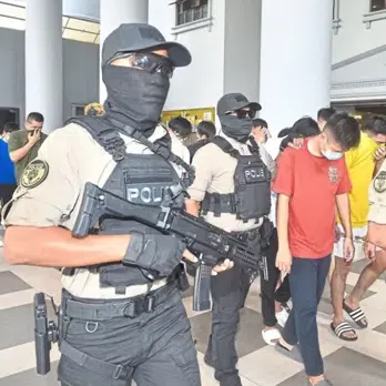 Police escort to court some of the men involved in the attack.