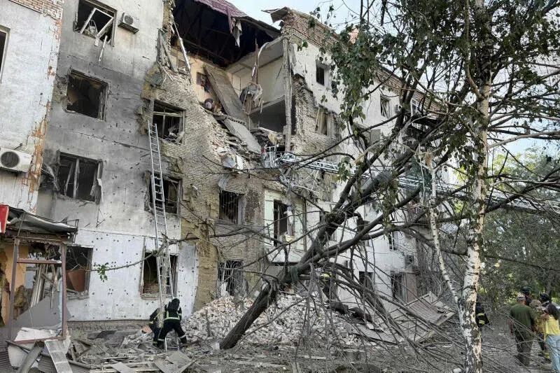 Rescuers clearing debris in a partially destroyed residential building following a Russian strike in Zaporizhzhia, Ukraine, on July 19.