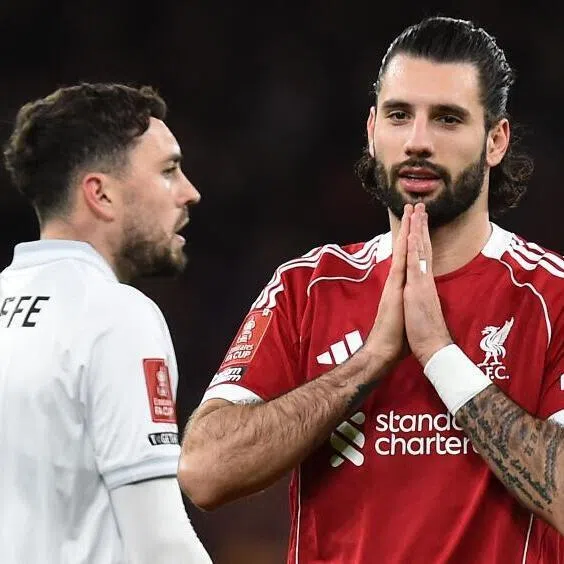 Liverpool's midfielder Dominik Szoboszlai (right) celebrates scoring the opening goal during the FA Cup third round football match against Barnsley on Jan 12, 2026.