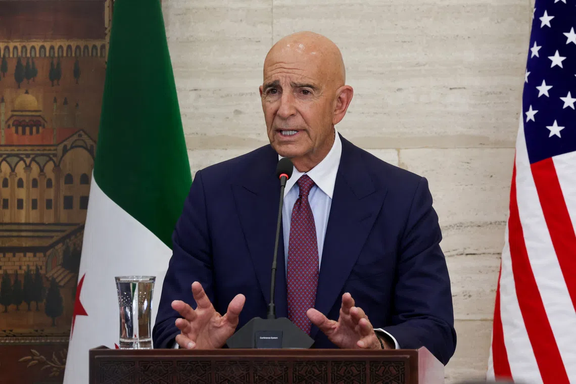 FILE PHOTO: U.S. special envoy for Syria Tom Barrack speaks during a press conference with Syrian Foreign Minister Asaad Hassan al-Shibani and Jordanian Foreign Minister Ayman Safadi, in Damascus, Syria September 16, 2025. REUTERS/Khalil Ashawi/File Photo