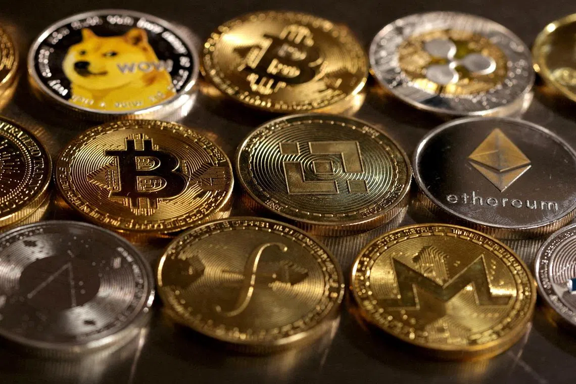 FILE PHOTO: Representations of cryptocurrencies are seen in this illustration, August 10, 2022. REUTERS/Dado Ruvic/Illustration/File Photo