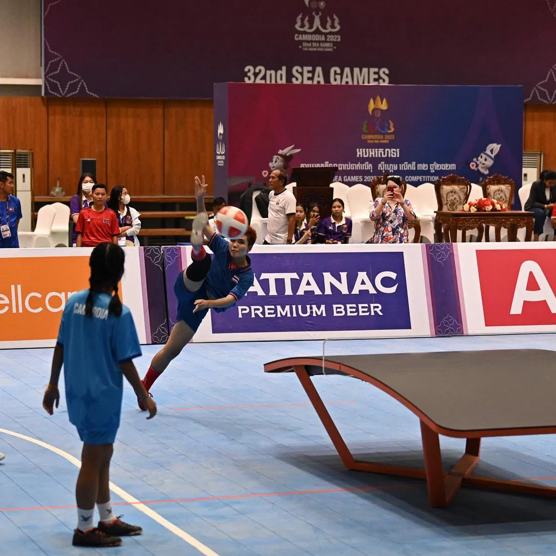 Thailand's Jutatip Kuntatong (centre) with teammate Suphawadi Wongkhamchan (left) in their women's doubles group stage teqball match against Cambodia at SEA Games on Saturday. 