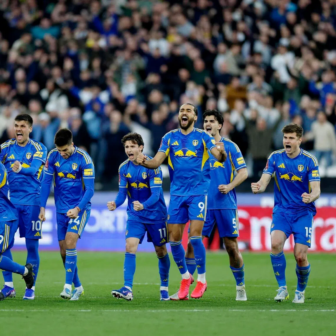 Leeds United players celebrating after winning the penalty shoot-out following their 2-2 draw with West Ham United in the FA Cup quarter-finals at the London Stadium on April 5. 