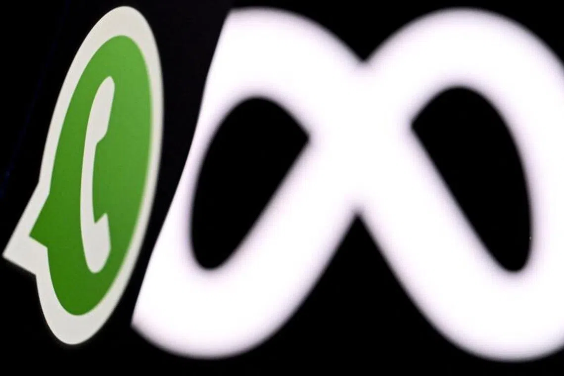 (FILES) This photo illustration created on January 9, 2025, in Frankfurt am Main, western Germany, shows US instant messaging software Whatsapp logo displayed on a smartphone in front of the media giant Meta's logo on a laptop screen. Social media juggernaut Meta stands trial on April 14, 2025, facing serious US government allegations that it abused its market power to acquire Instagram and WhatsApp before they could become competitors. By moving forward, the trial in a Washington federal court dashes the hopes of Meta boss Mark Zuckerberg that the return of Donald Trump to the White House would see the government let up on the enforcement of antitrust law against Big Tech. (Photo by Kirill KUDRYAVTSEV / AFP)