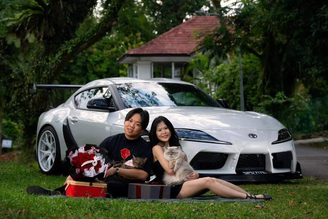 Mr Kevan Tan and Ms Hannah Sim with their cats, a brown tabby named Mew and a ragdoll named Mizu.