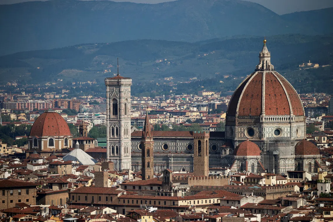 FILE PHOTO: Brunelleschi's Dome and Giotto's Campanile of the Cathedral of Saint Mary of the Flower (Cattedrale di Santa Maria del Fiore) are pictured from a panoramic point of Florence, in Tuscany region, Italy, April 15, 2024. REUTERS/Yara Nardi/File Photo