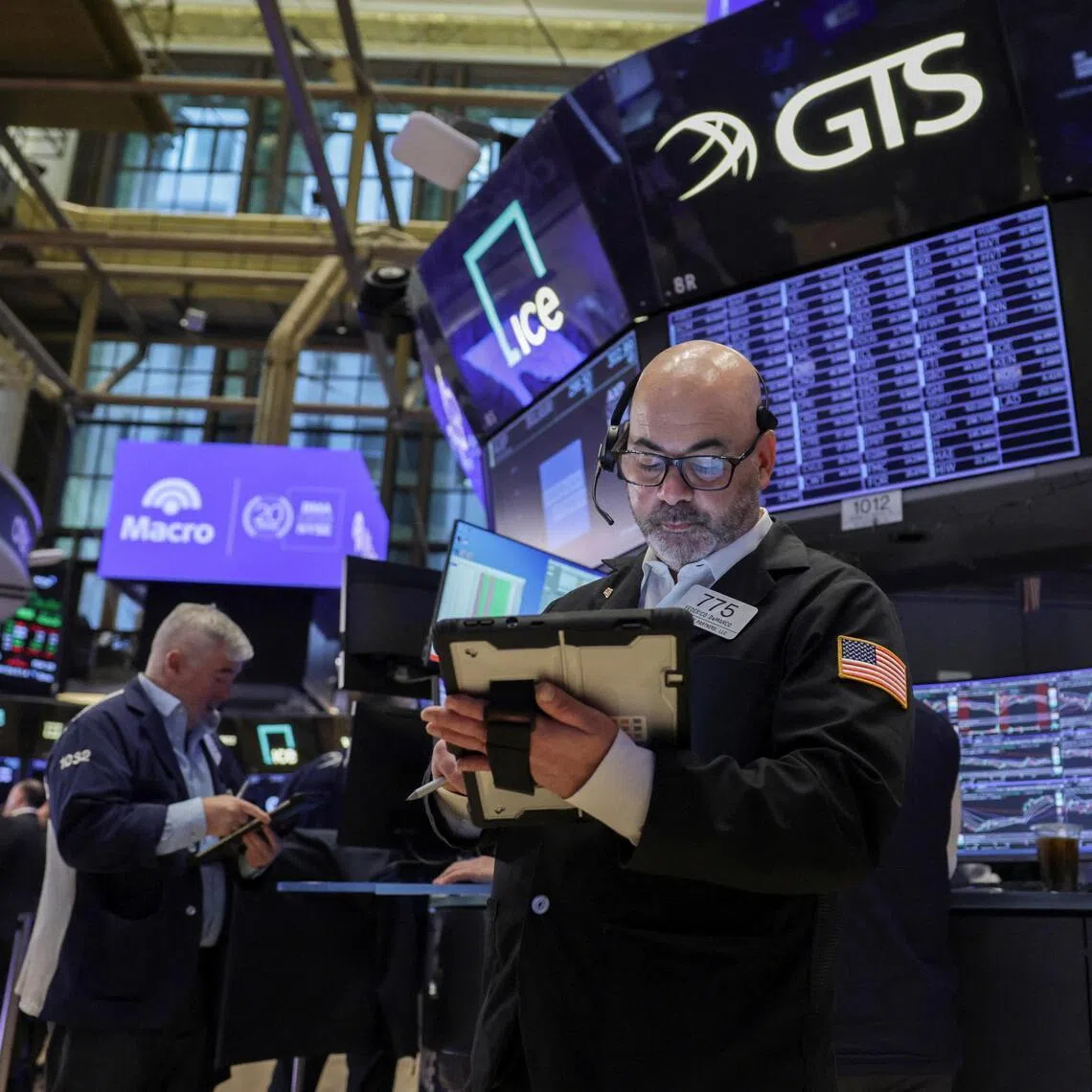 Traders working on the floor of the New York Stock Exchange, in New York City, on March 24.