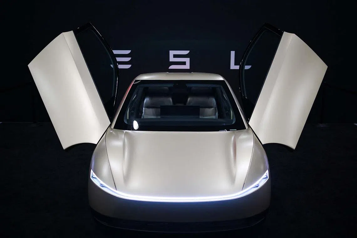 A Tesla Cybercab is displayed at the Los Angeles Auto Show, in Los Angeles, California, US, Nov 21, 2024. 