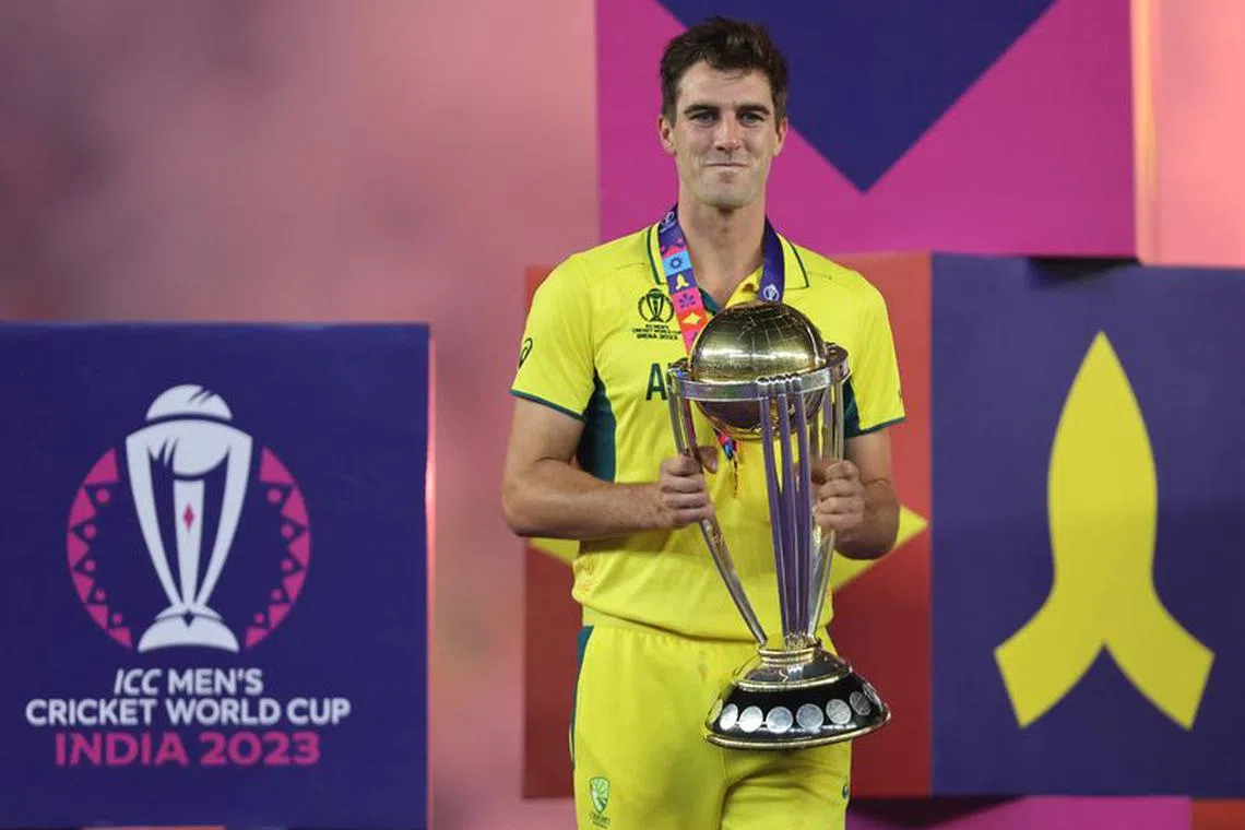 Cricket - ICC Cricket World Cup 2023 - Final - India v Australia - Narendra Modi Stadium, Ahmedabad, India - November 19, 2023 Australia's Pat Cummins celebrates with the trophy after winning the ICC Cricket World Cup REUTERS/Amit Dave