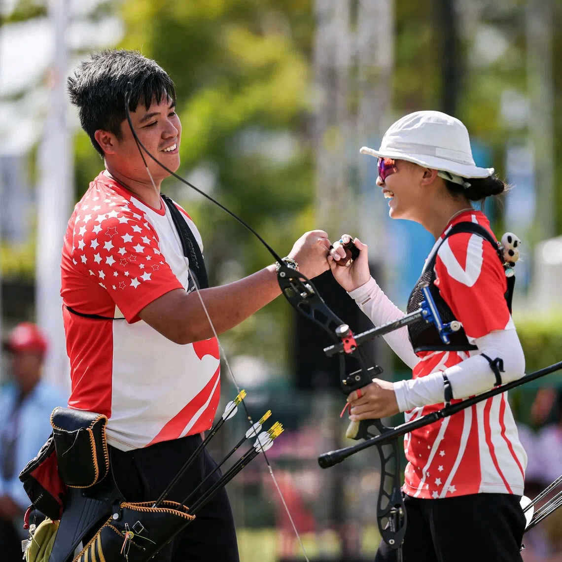 Li Yue Long (left) and Tabitha Yeo beat Malaysia on Dec 17 to become the nation’s first SEA Games archery mixed recurve team champions.