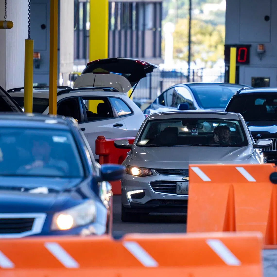 Cars entering the US from Canada through the Detroit-Windsor Tunnel in Michigan on Aug 25, 2026. Canada is imposing retaliatory tariffs on a range of US goods after trade negotiations broke down.