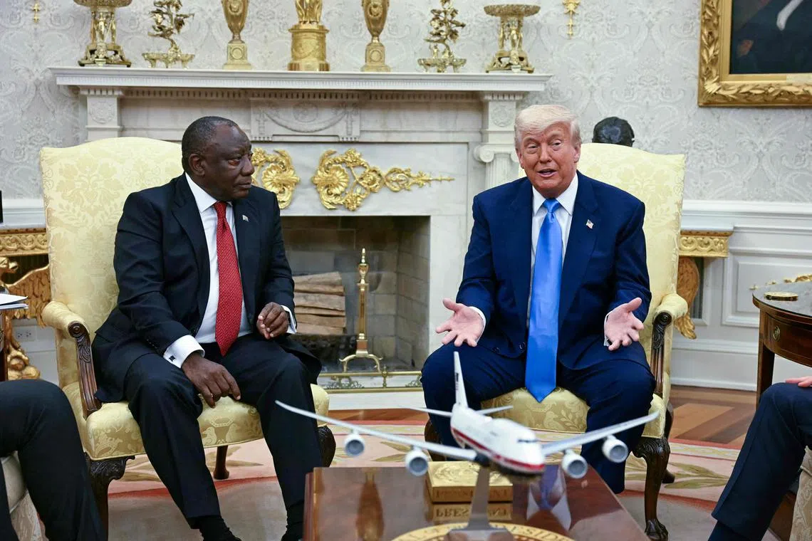 US President Donald Trump meets with South African President Cyril Ramaphosa in the Oval Office of the White House in Washington, DC, on May 21, 2025. South African President Cyril Ramaphosa meets Donald Trump on Wednesday amid tensions over Washington's resettlement of white Afrikaners that the US president claims are the victims of "genocide." (Photo by Jim WATSON / AFP)
