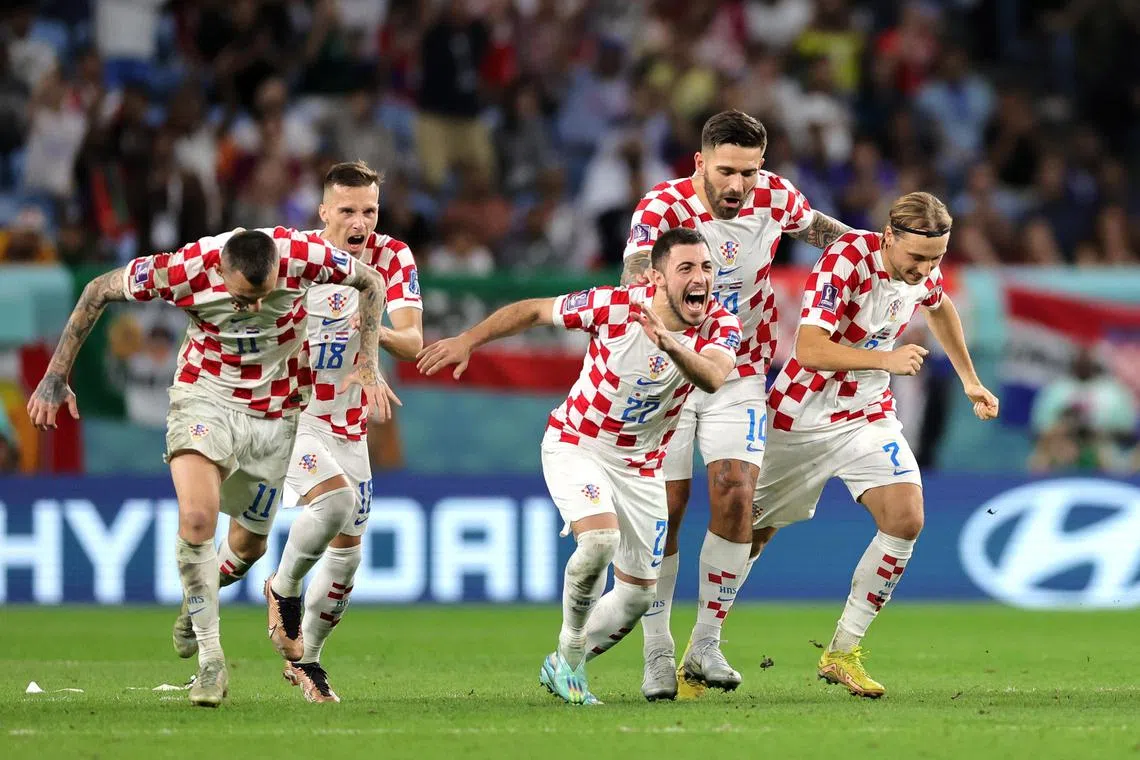 Croatia players celebrate after winning the penalty shoot-out of the round of 16 match against Japan on Dec 5.