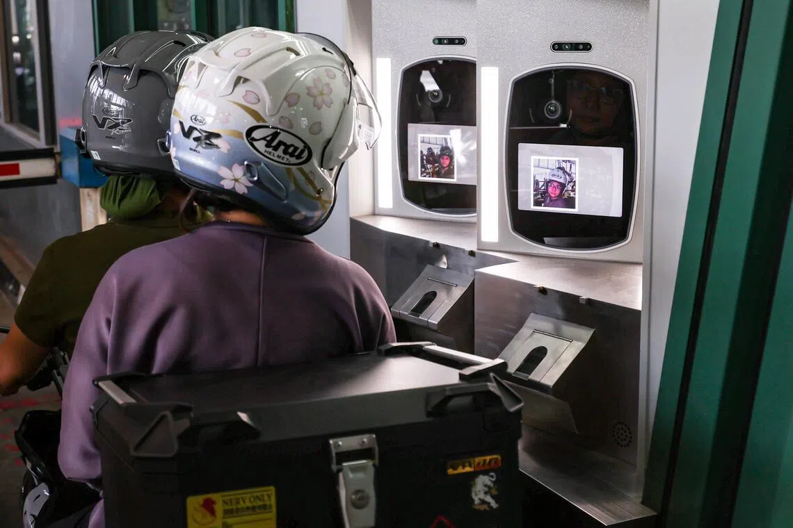 A demonstration of facial recognition clearance for motorcyclists and pillion riders at Woodlands Checkpoint on March 26, 2026. From March 31, facial images will progressively replace fingerprints as the primary biometric identifier for motorcycle travellers at land checkpoints, as part of the Immigration & Checkpoints Authority?s (ICA) New Clearance Concept aimed at enabling faster, contactless and more secure immigration clearance.