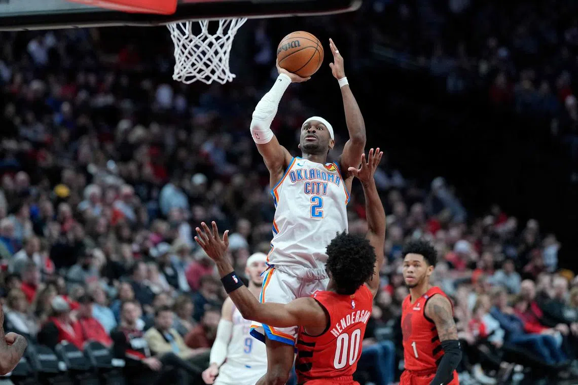 Shai Gilgeous-Alexander of the Oklahoma City Thunder shooting the ball over Scoot Henderson of the Portland Trail Blazers during the first half at Moda Centre on Jan 26 in Portland, Oregon. Gilgeous-Alexander poured in 35 points in his team's 118-108 NBA win.