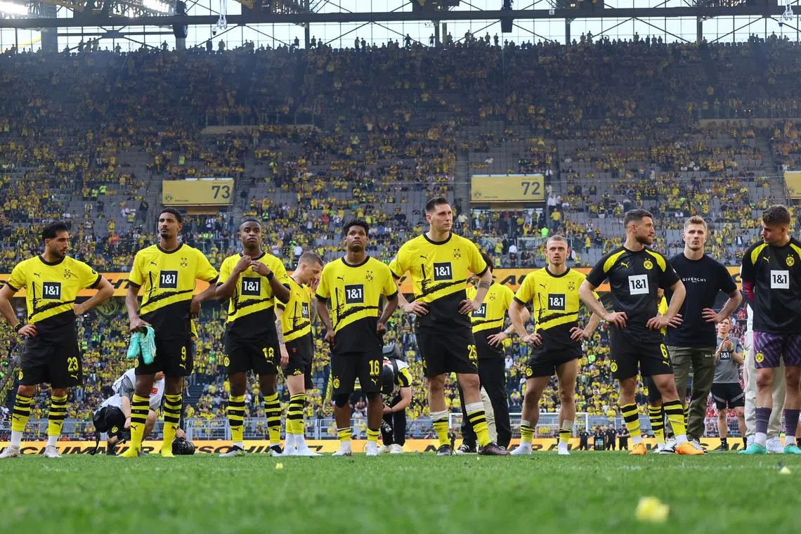 FILE PHOTO: Soccer Football - Bundesliga - Borussia Dortmund v 1. FSV Mainz 05 - Signal Iduna Park, Dortmund, Germany - May 27, 2023 Borussia Dortmund's Julien Duranville, Emre Can, Sebastien Haller, Youssoufa Moukoko and Niklas Suele look dejected after the match REUTERS/Wolfgang Rattay/File Photo