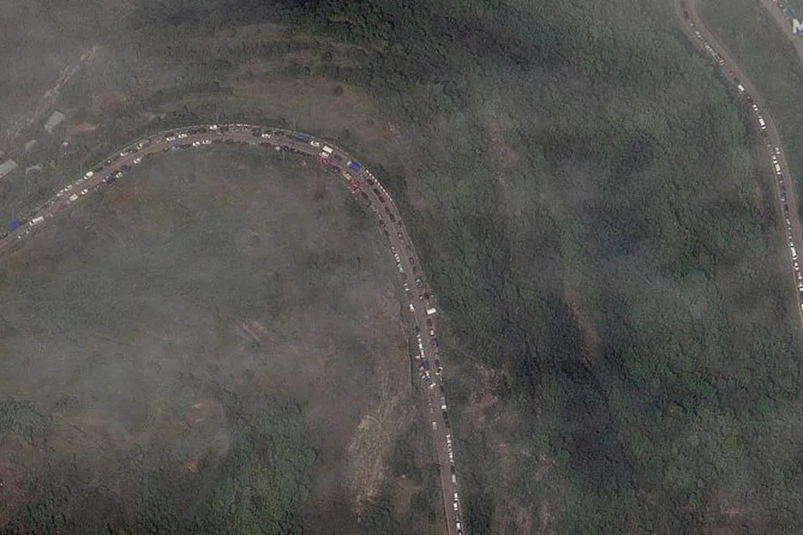 A satellite image shows a long traffic jam of vehicles along the Lachin corridor as ethnic Armenians flee from the Nagorno-Karabakh region, September 26, 2023. Maxar Technologies/Handout via REUTERS.