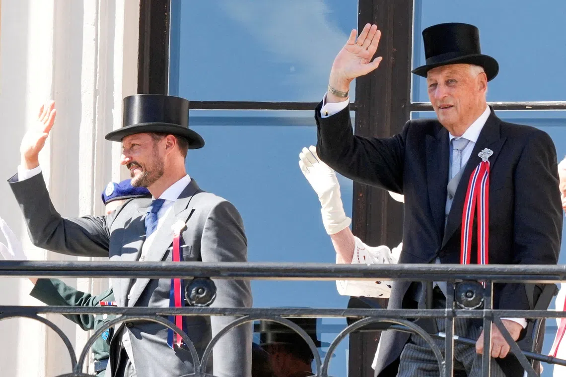 FILE PHOTO: Norway's King Harald and Crown Prince Haakon greet the children's train from the Castle Balcony at the Castle, in Oslo, Norway, May 17, 2024. NTB/Heiko Junge/via REUTERS/File Photo