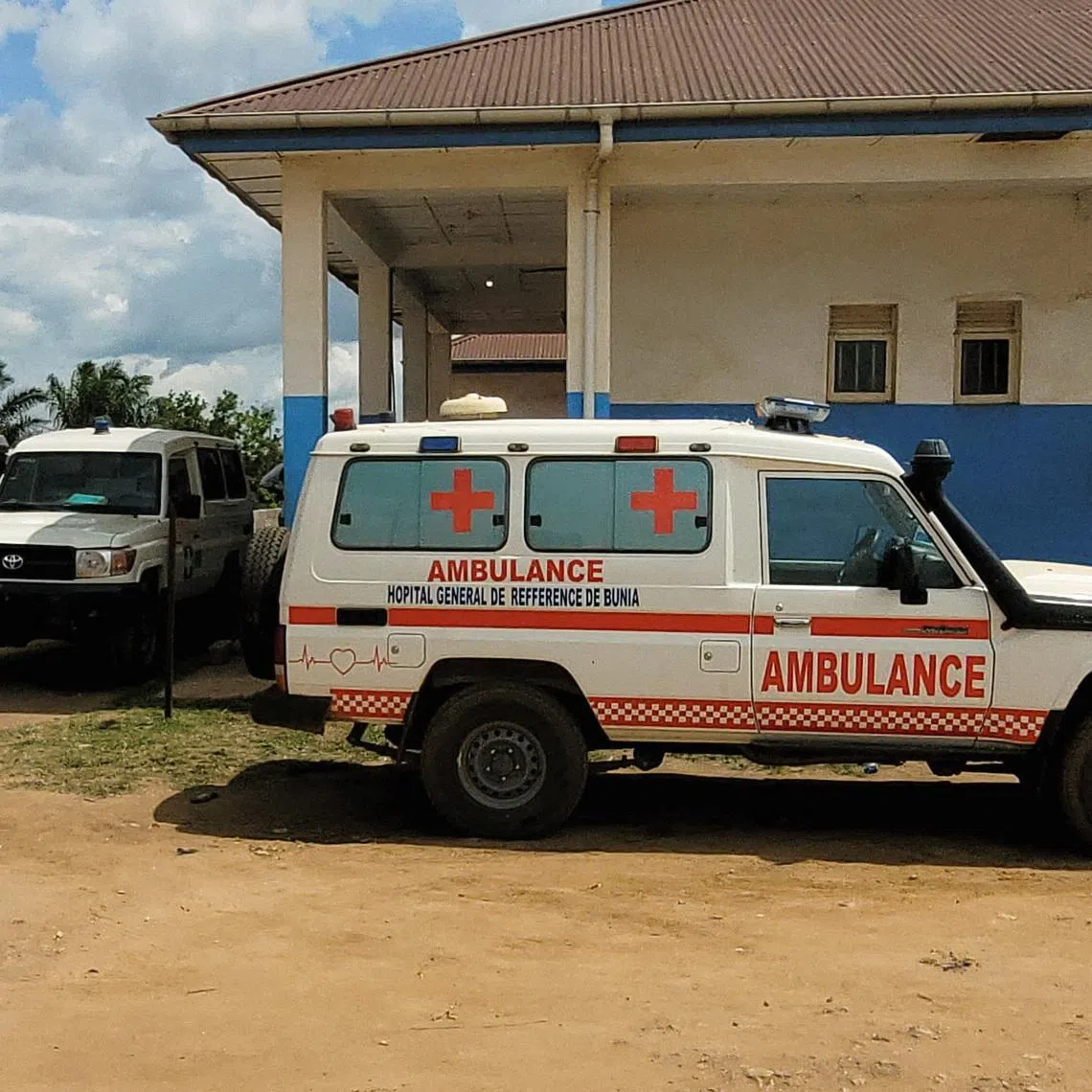 Ambulances parked at Bunia General Referral Hospital following confirmation of an Ebola outbreak involving the Bundibugyo strain in Bunia, Ituri province, Democratic Republic of Congo, May 16, 2026. Picture taken with a mobile phone. REUTERS/Victoire Mukenge