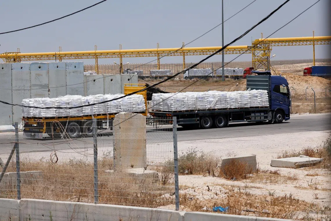 Egyptian trucks carrying humanitarian aid make their way to the Gaza Strip  at the Kerem Shalom crossing in southern Israel on May 30. 