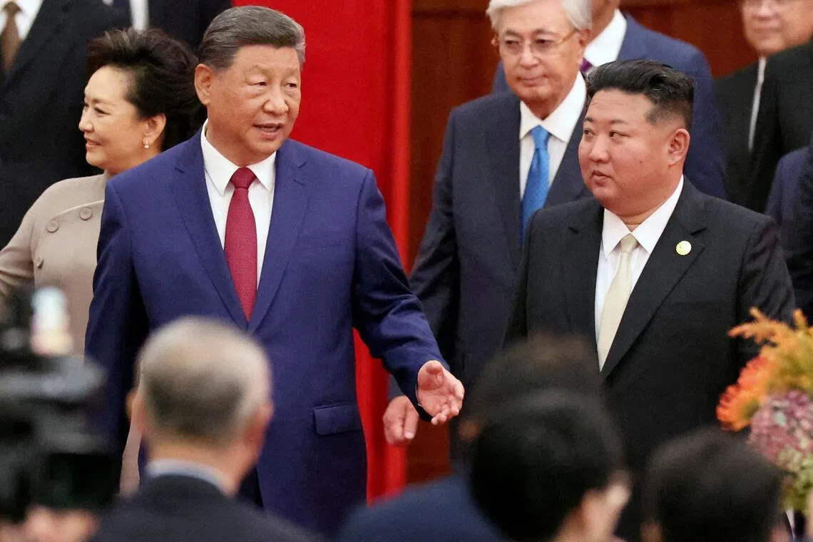 Chinese President Xi Jinping and North Korean leader Kim Jong Un arrive for a reception in Beijing on Sept 3, 2025.