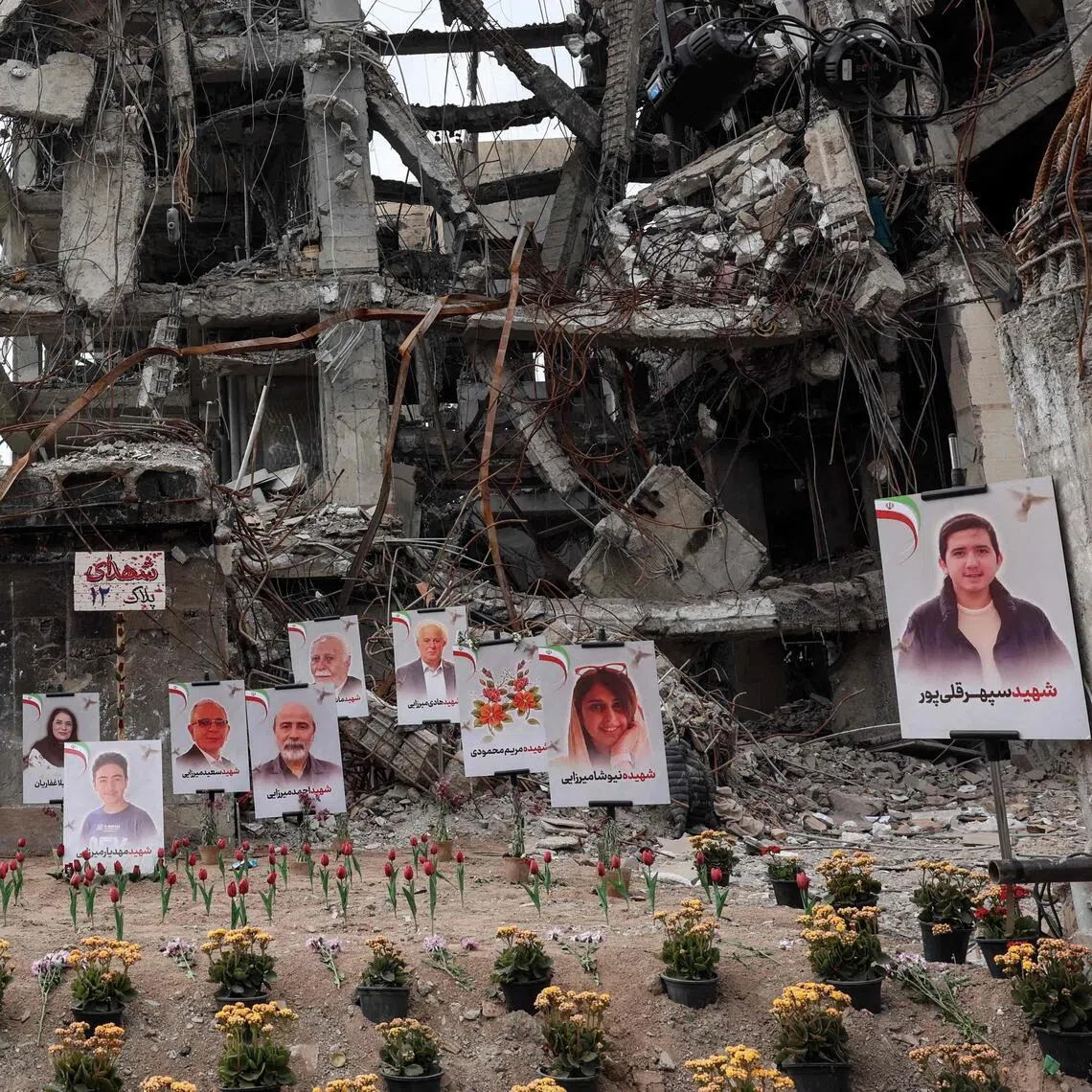 Portraits of victims reportedly killed in a US-Israeli airstrike on a residential building in Tehran, on April 13.