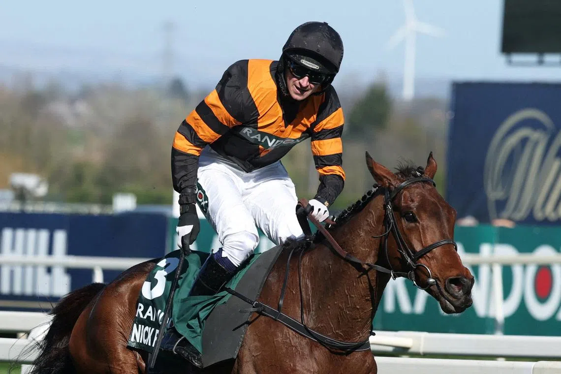 FILE PHOTO: Horse Racing - Grand National Festival 2025 - Aintree Racecourse, Liverpool, Britain - April 5, 2025  Patrick Mullins riding Nick Rockett celebrate after winning the 16:00 Randox Grand National Handicap Chase REUTERS/Phil Noble/File Photo