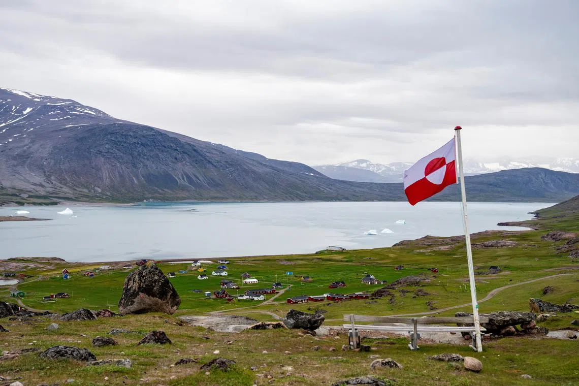 FILE PHOTO: Greenland's flag flies in Igaliku settlement, Greenland, July 5, 2024. Ritzau Scanpix/Ida Marie Odgaard via REUTERS/File Photo