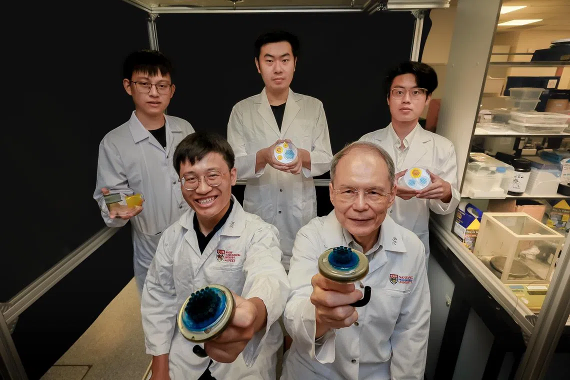 From left: 
Research Fellow Dr Liu Yangchengyi, Research Fellow Dr Linghu Changhong, PhD student Mr Huo Yucheng, Professor K Jimmy Hsia, President's Chair in Mechanical Engineering, and Undergraduate Mr Jiang Haoyu holding the Shape Memory Polymer (SMP) Adhesive Fibril Arrays at NTU on April 29, 2024.
