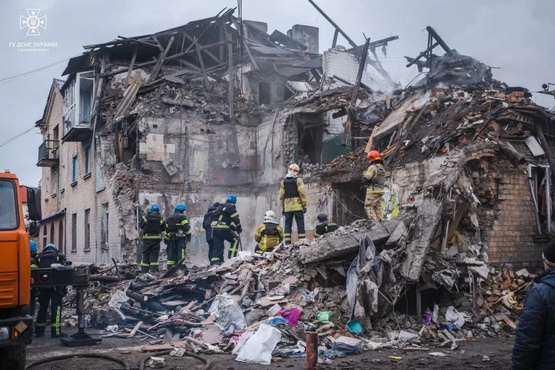 FILE PHOTO: Rescues work at a site of a residential building heavily damaged by a Russian missile strike, amid Russia's attack on Ukraine, in the town of Novohrodivka, Donetsk region, Ukraine November 30, 2023. Press service of the State Emergency Service of Ukraine in Donetsk region/Handout via REUTERS/File Photo