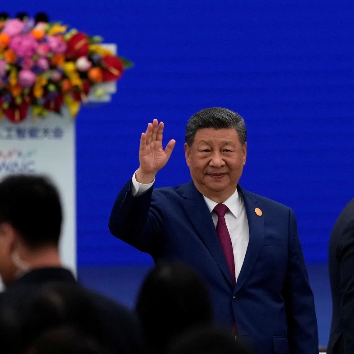 FILE PHOTO: Chinese President Xi Jinping waves as he arrives at the opening ceremony for the World AI Conference in Shanghai, China, July 17, 2026.     Ng Han Guan/Pool via REUTERS/File Photo